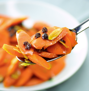 Glazed curried carrots with currants and almonds