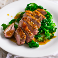 Glazed duck breast with braised greens