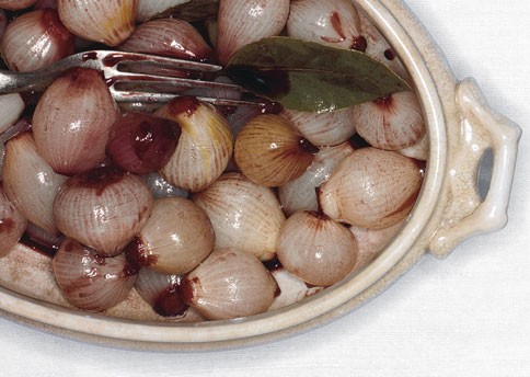Glazed pearl onions in Port with bay leaves