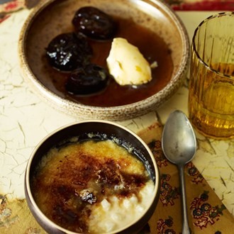 Glazed rice pudding with boozy prunes