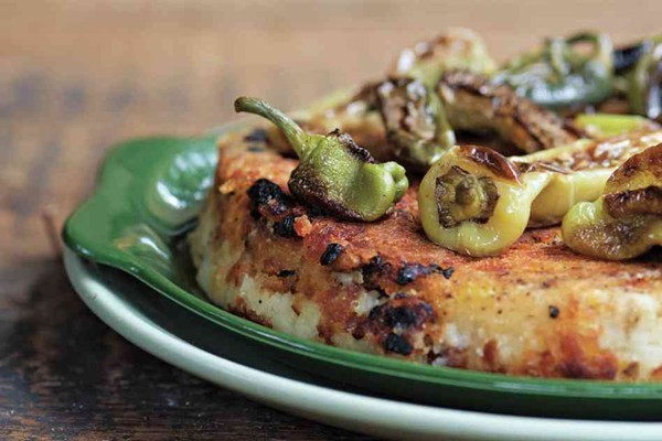 Glorified hash-brown cake with frying peppers