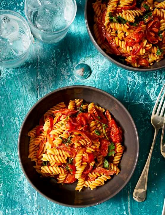 Gluten-free fusilli with salami and cherry tomatoes