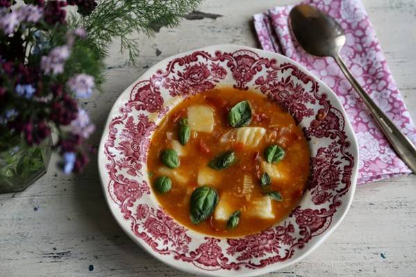 Gluten-free gnocchi in tomato and basil broth