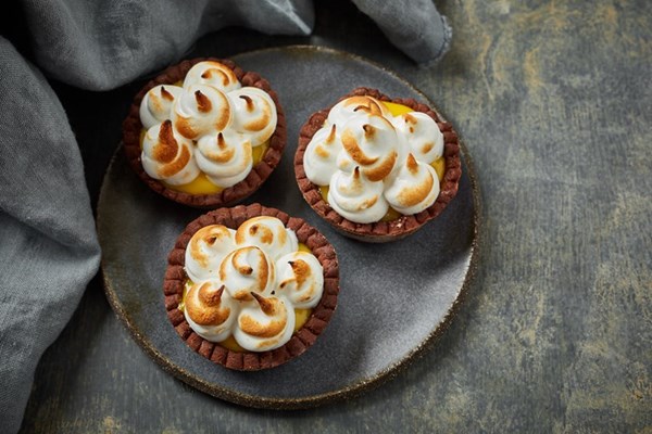 Gluten-free passion fruit and chocolate meringue tartlets