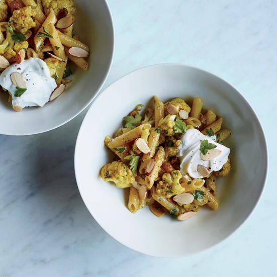 Gluten-free penne with curry-roasted cauliflower and raisins