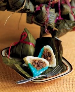 Glutinous rice and pork dumplings wrapped in pandan leaf (Nonya kueh chang)