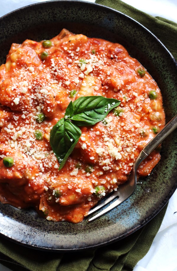 Gnocchi and peas in tomato cream sauce