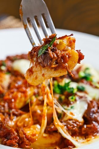 Gnocchi poutine with short rib ragu and gremolata