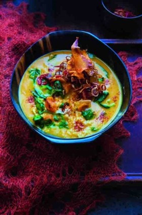 Goan pumpkin and coconut soup with rice, spinach and crispy toppings