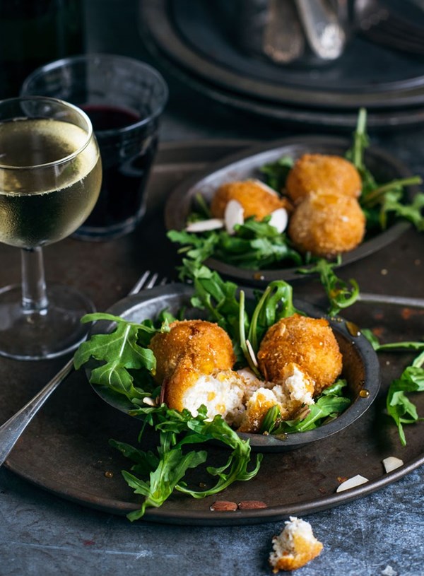 Goat cheese croquettes with honey and toasted almonds