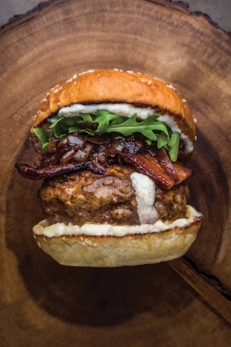 Goat cheese-stuffed lamb burgers with caramelized red onions