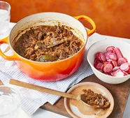 Goat mole chilli with pickled radishes