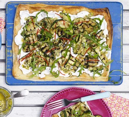 Goat's cheese and courgette tart with pistachio dressing
