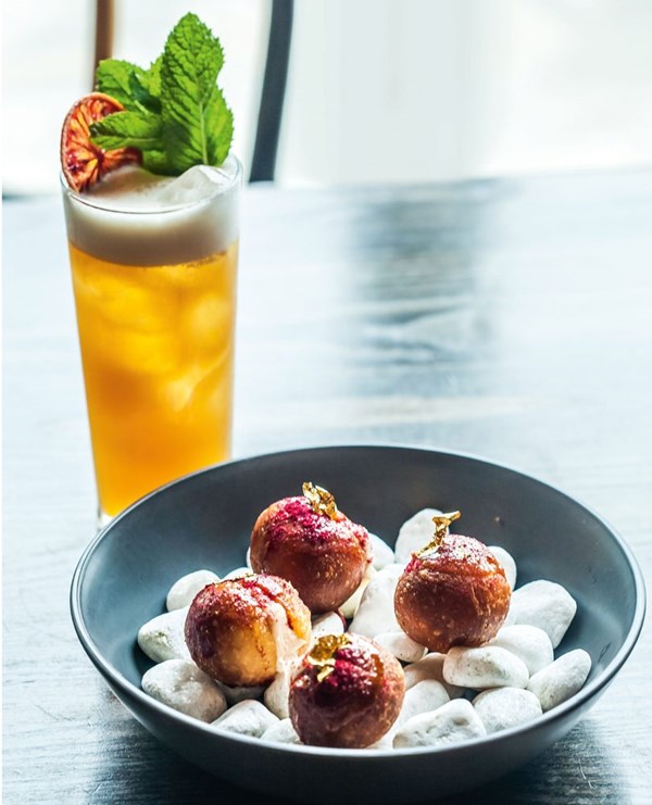 Goat's cheese doughnuts with raw honey