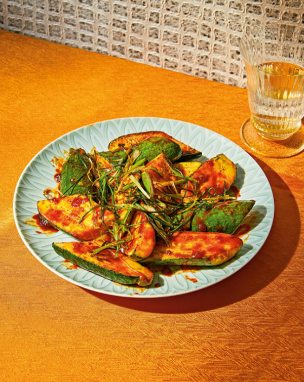 Gochujang-glazed zucchini with fried scallions