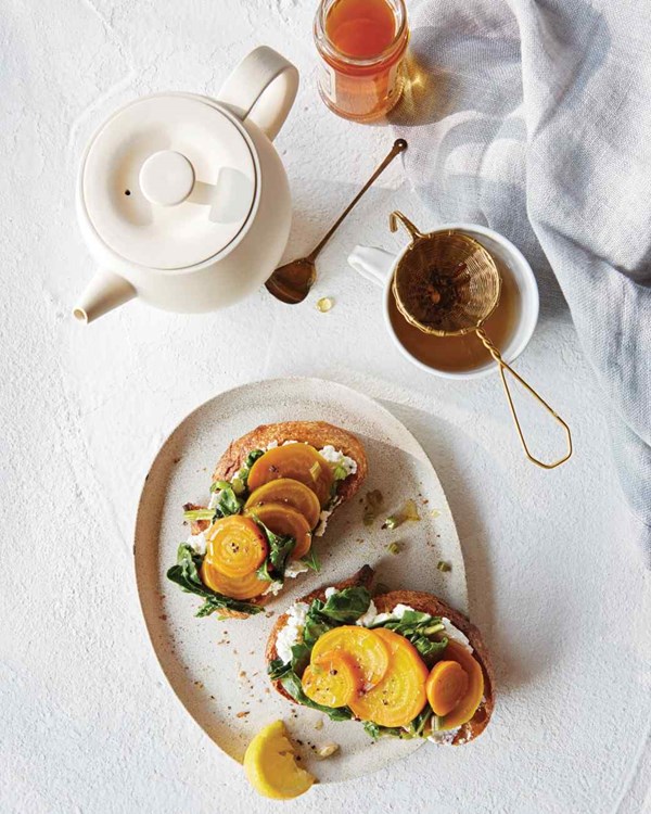 Golden beets with greens and ricotta on toast