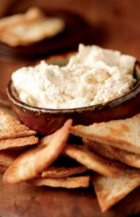Golden onions and thyme dip with toasted pita chips