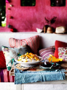 Golden Pavlova with mango yoghurt and tropical fruits