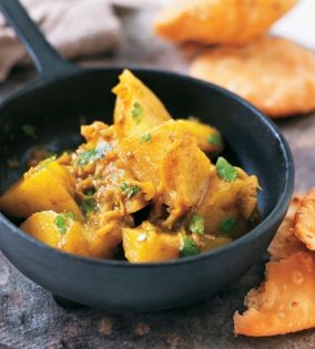 Golden potato cubes with chilli and coriander