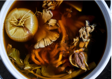 Golden tonic elixir with turmeric mushrooms and black garlic