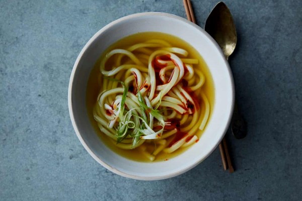 Golden turmeric and ginger udon noodle soup