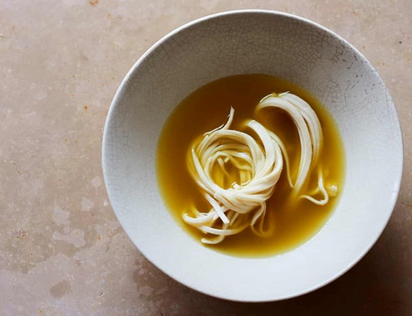 Golden turmeric and ginger udon noodle soup