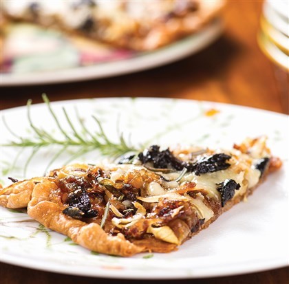 Golden Vidalia onion tart with olives and rosemary