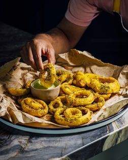 Golden za'atar onion rings with buttermilk caraway dipping sauce