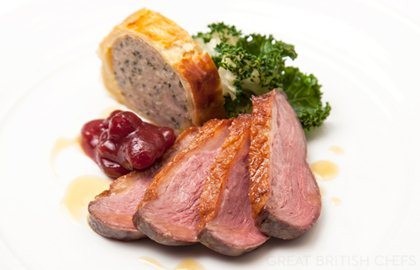 Goose breast with goose leg sausage roll, kale and cranberry relish