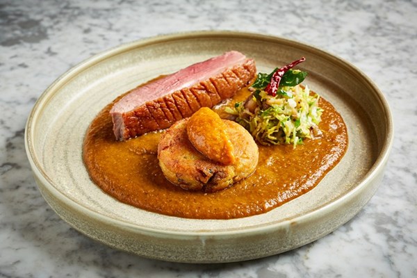 Goose vindaloo with confit leg aloo tiki, sprout and chestnut thoran and apple chutney