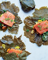 Grape leaf-wrapped salmon with serrano-scallion sauce