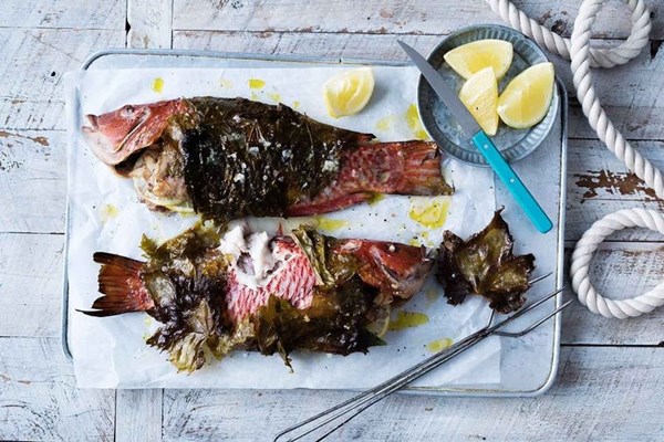 Grape-leaf-wrapped wrasse with almonds and lemon
