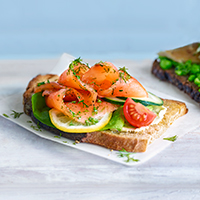 Gravadlax salmon open sandwich with mustard dressing