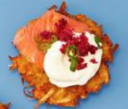 Gravlax and crème fraîche topped latkes