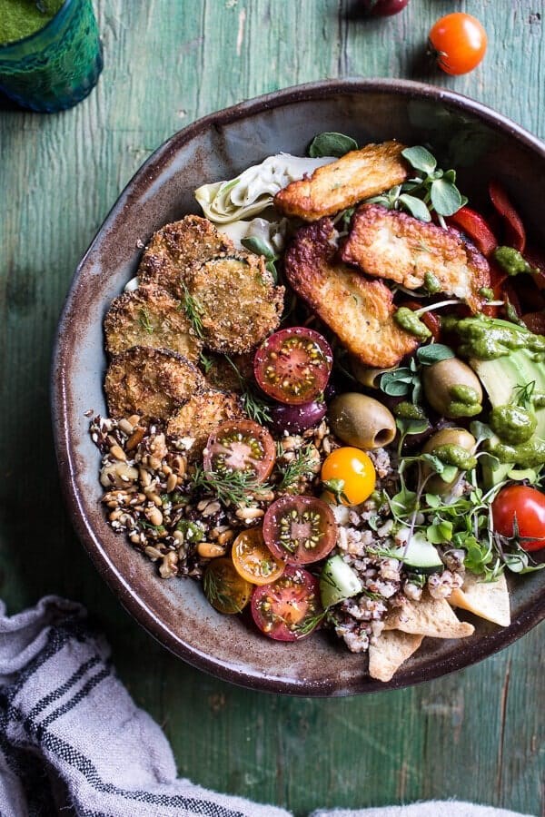 Greek goddess grain bowl with fried zucchini, toasted seeds and fried halloumi