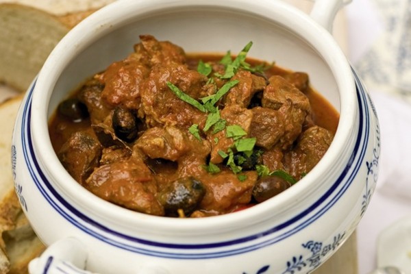 Greek lamb casserole with peppered feta