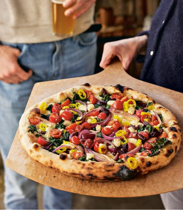 Greek pizza with spinach, cherry tomatoes, kalamata olives and feta