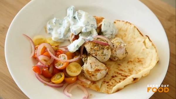 Greek-style chicken with pickled onions, tomatoes, and tzatziki