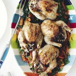 Greek-style stuffed baby chickens with carrots and wilted greens