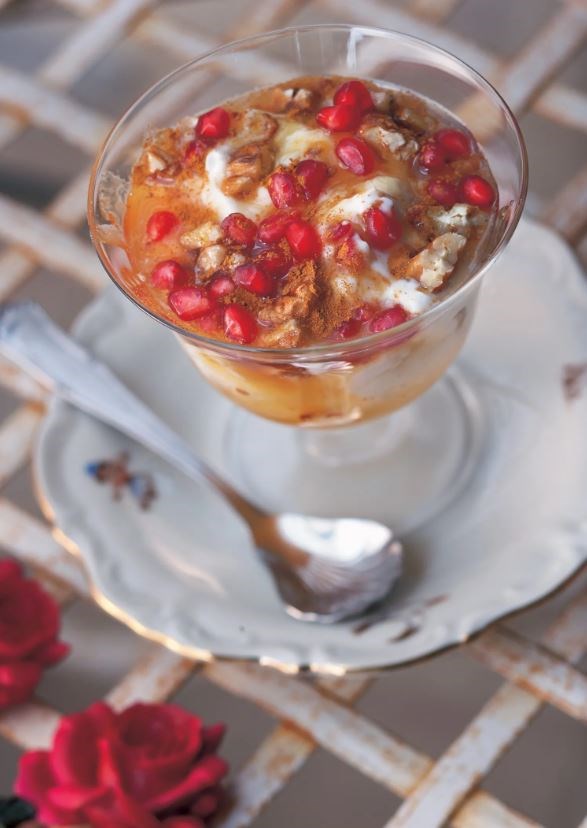 Greek yogurt with honey, cinnamon, pecans, and pomegranate