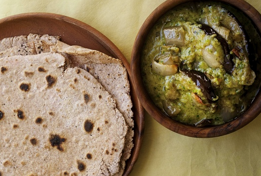 Green aubergine curry with Indian flatbreads