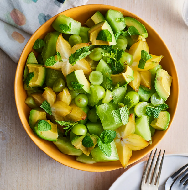 Green fruit salad with avocado and mint