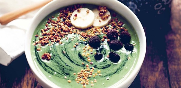 Green galaxy smoothie bowl with buckwheat crispies