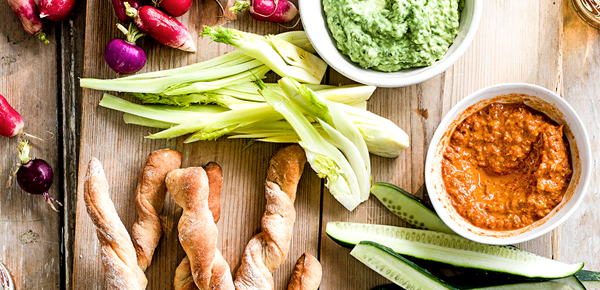 Green goddess and red devil dips with homemade breadsticks and veg