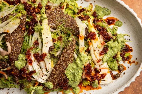 Green goddess-tahini salad with chilli crisp and flaxseed crackers