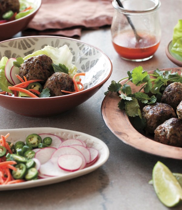 Green herb and peanut pork meatballs in lettuce cups