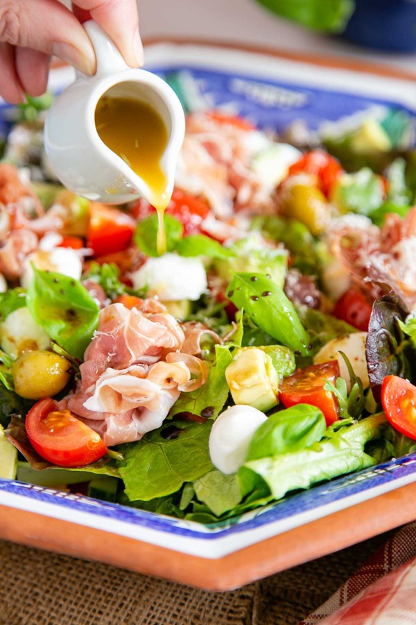 Green Italian salad with antipasti