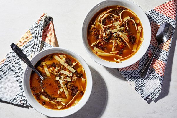 Green lentil soup with noodles and mint