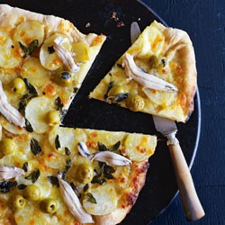 Green olive, anchovy, oregano and potato pizzas