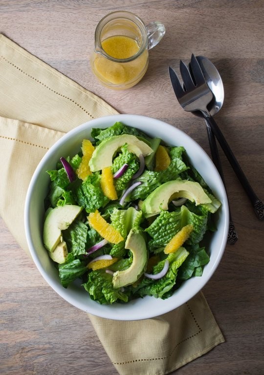 Green salad with orange, avocado, and red onion